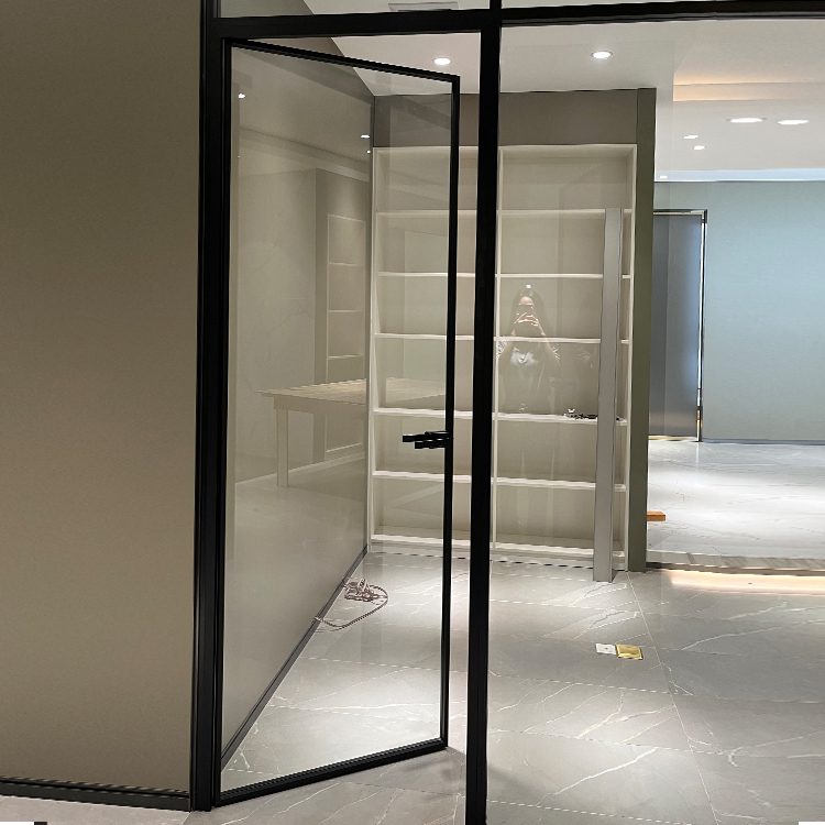Slim frame aluminium pivot door with large glass panel