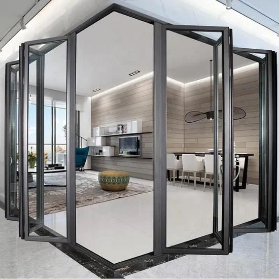 Aluminium folding door fully opened between living room and terrace